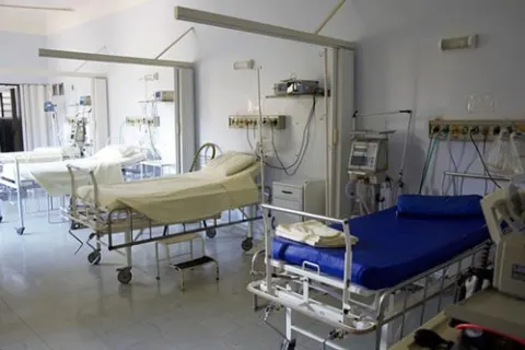 Hospital ward with adjustable beds and bedside monitoring equipment